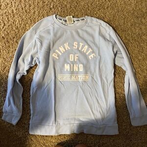 Pink pullover is a soft blue size XS
